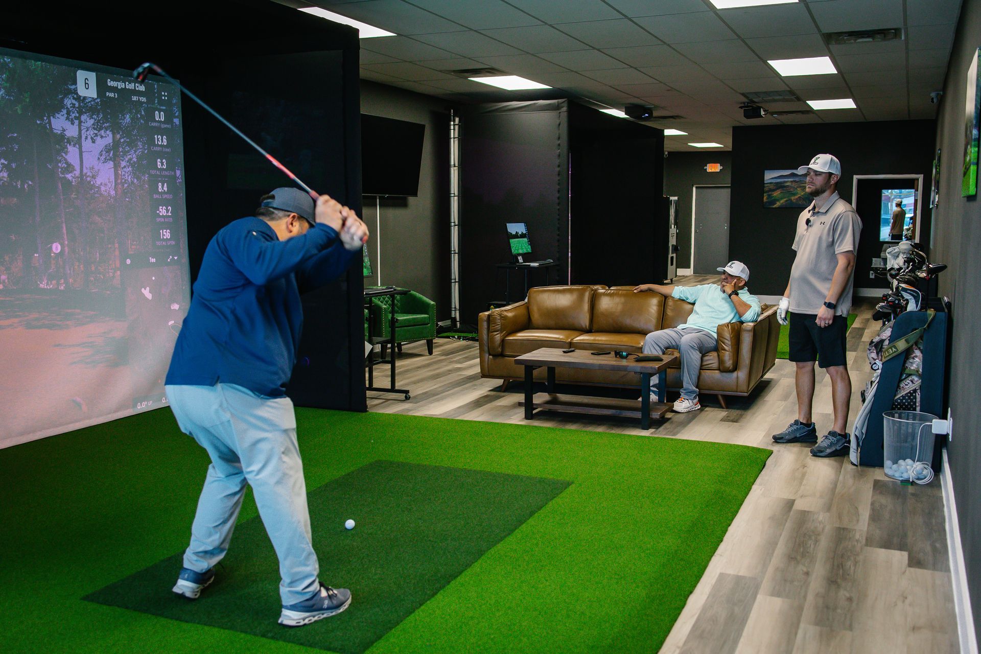 Golfers playing inside Tee Time Granbury